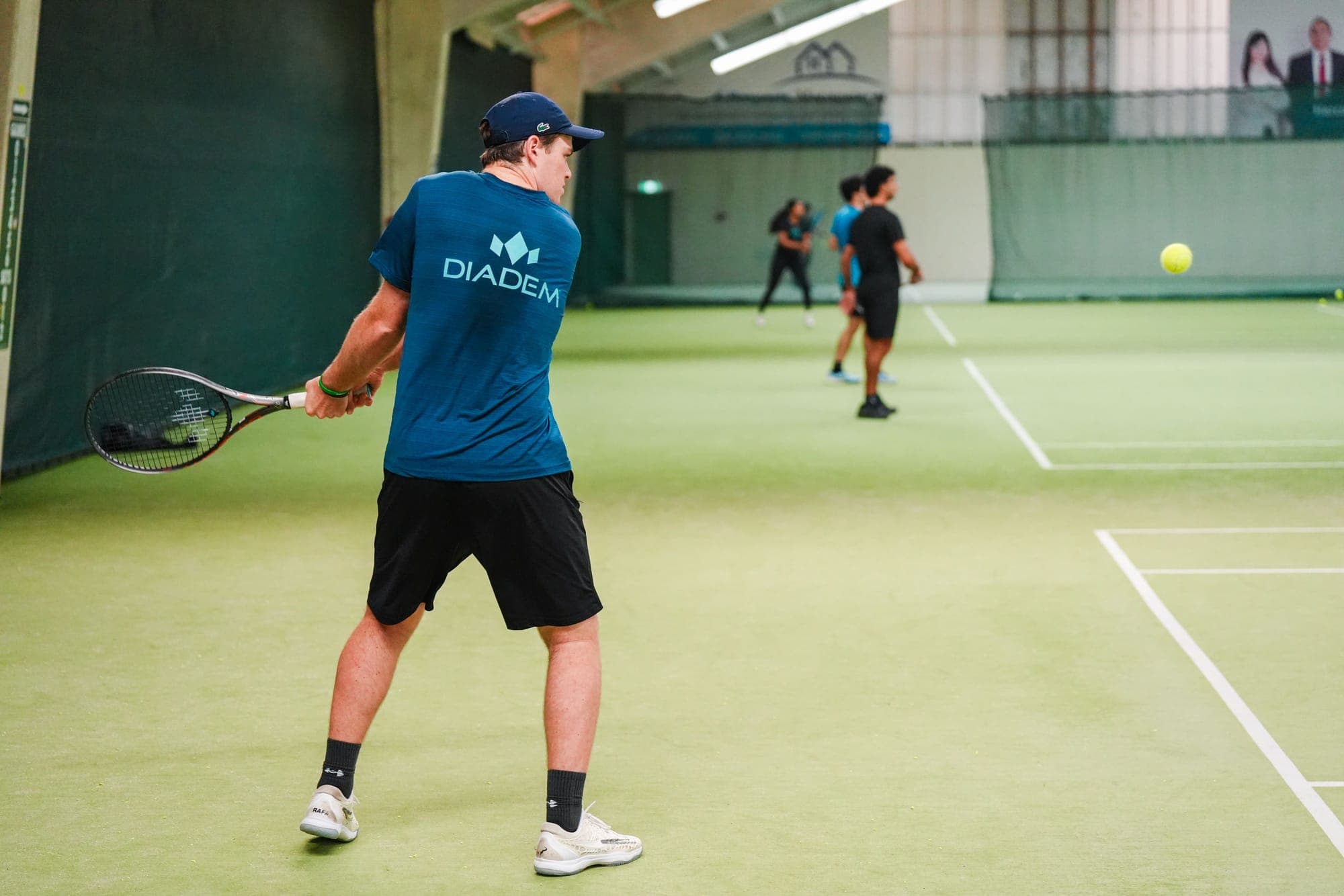 A Diadem hitting partner playing a forehand