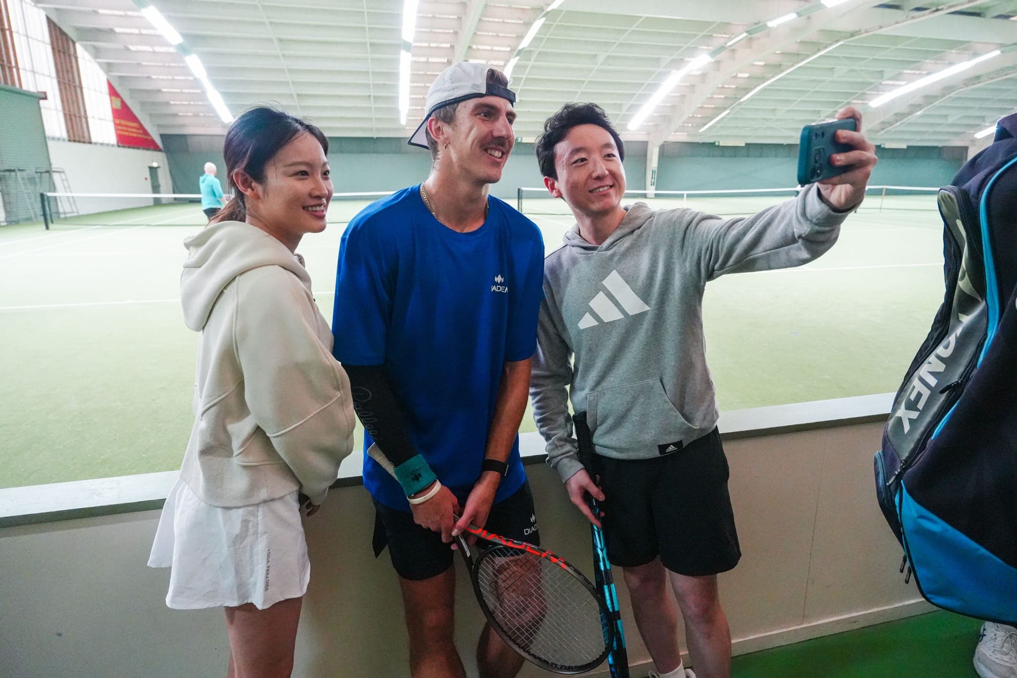 Anton in a selfie with two fans