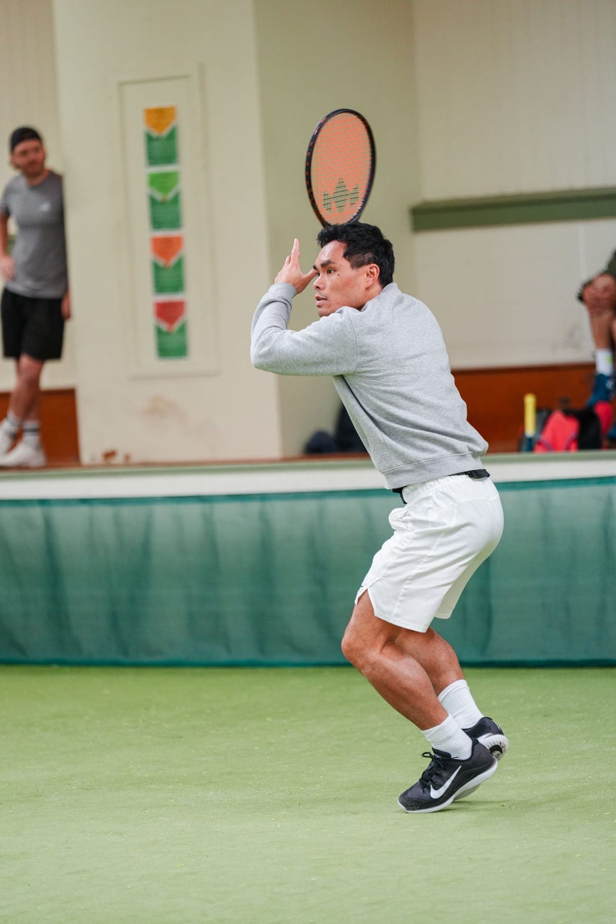 A player lining up a forehand on the demo court