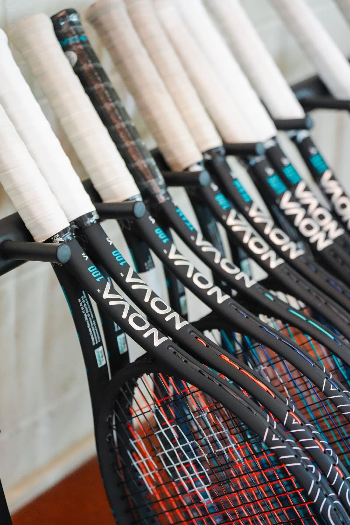 A row of Diadem Nova rackets on the stand